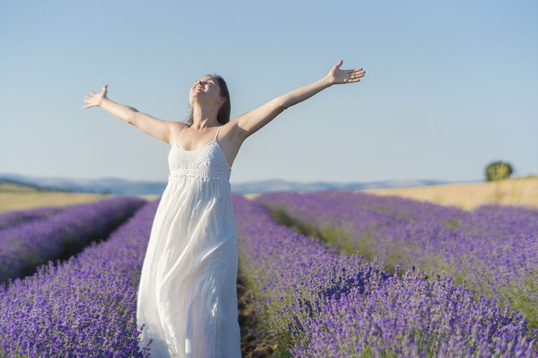 woman open arms at lavender field