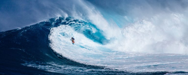 man surfing with big wave