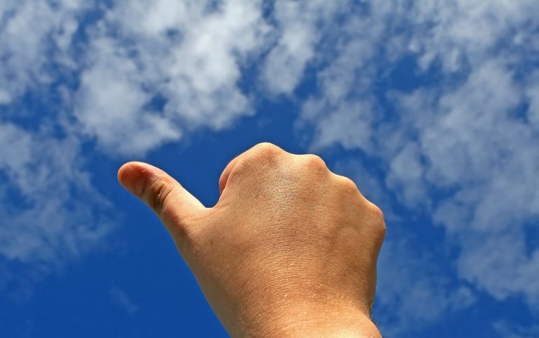 thumbs up on sky