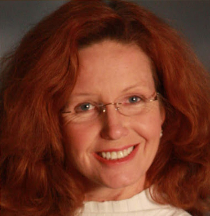 middle-aged redhead woman smiling